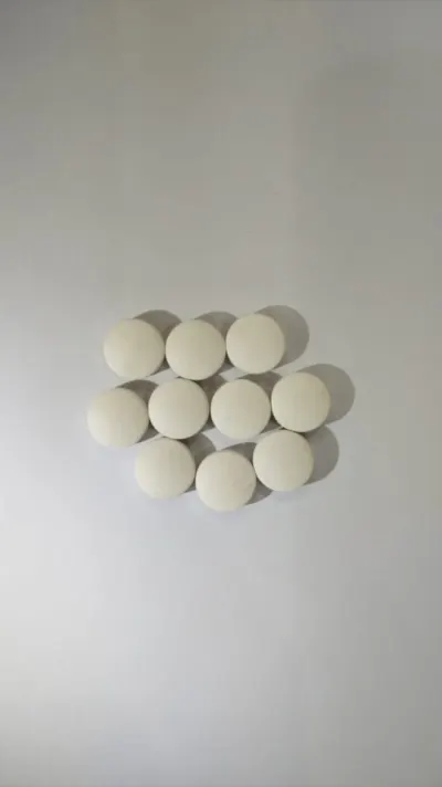 White film coated round tablets